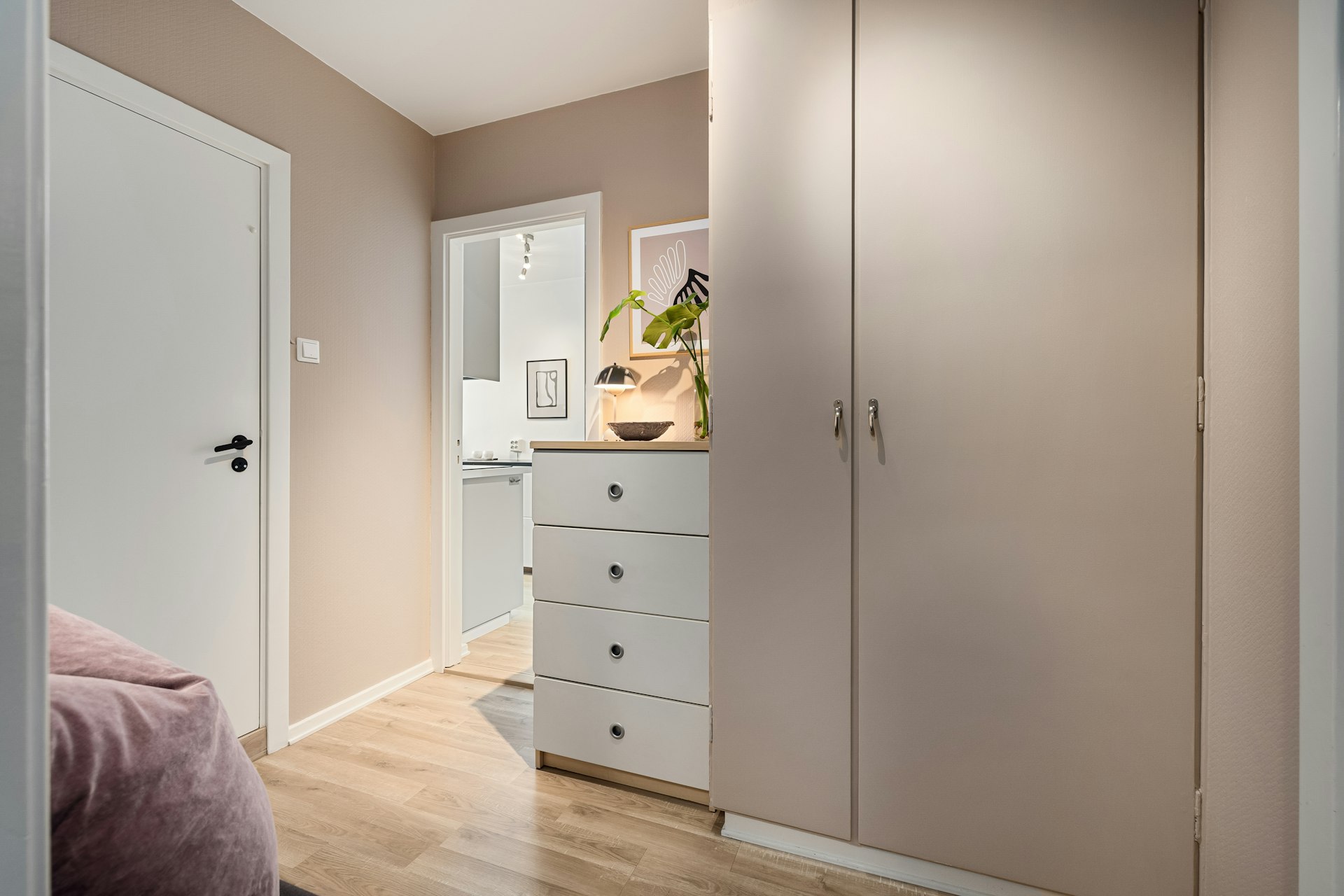 A bedroom with a bed and a closet